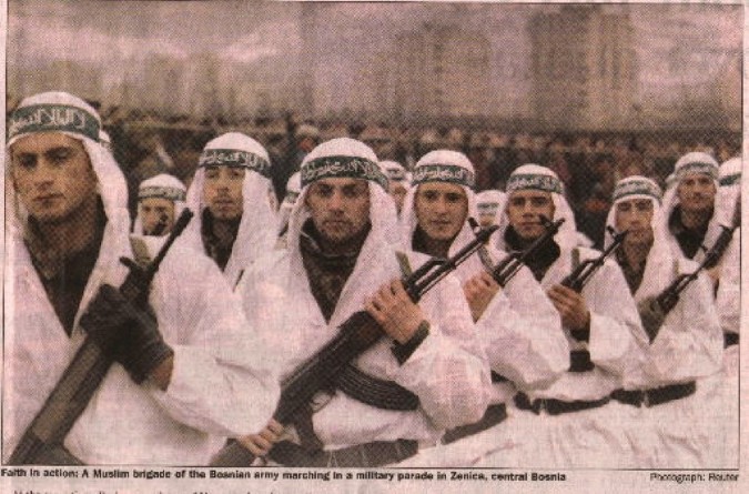Previous 3 photos above) Alija Izetbegovic’s 10,000 strong Islamist fundamentalist “El Mujahedeen Unit” in Zenica, Bosnia on parade with green banners on their heads which read: “Our path is the Jihad” written in Arabic script.
